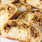 Sliced Sourdough Bierocks showing a chicken filling tucked inside soft rolls.