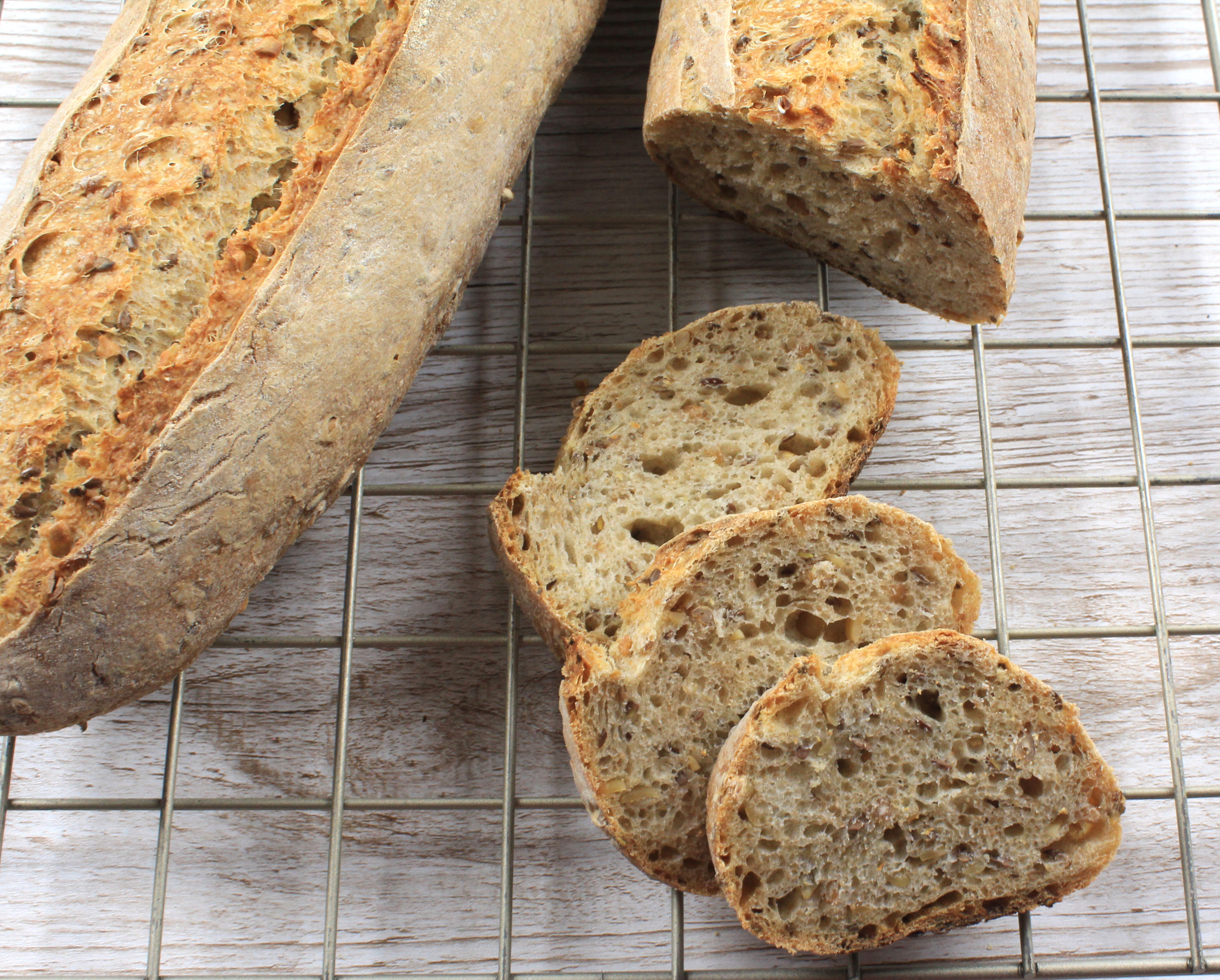 Five Grain Sourdough Rye Baguettes on cooling rack