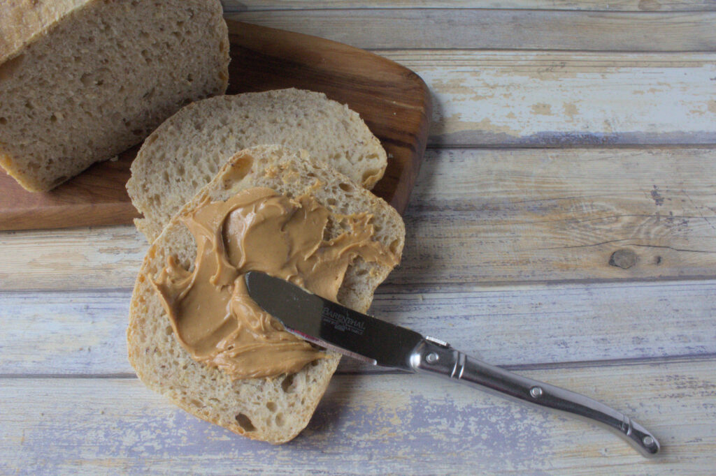 Slice of Sourdough Potato Flax Bread with Peanut Butter