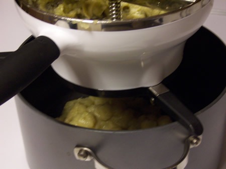 Running apple pulp through food mill