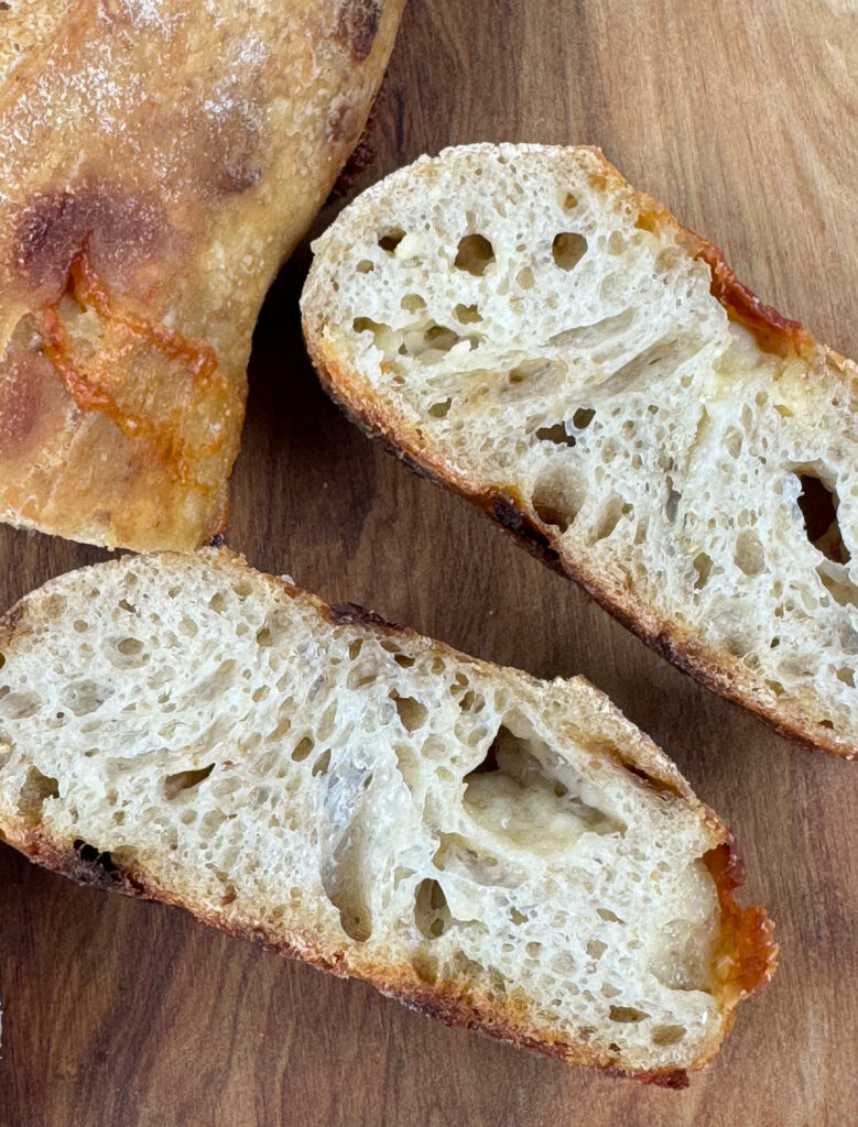 Close up of crumb shot of Caramelized Onion & Gruyère Baguettes