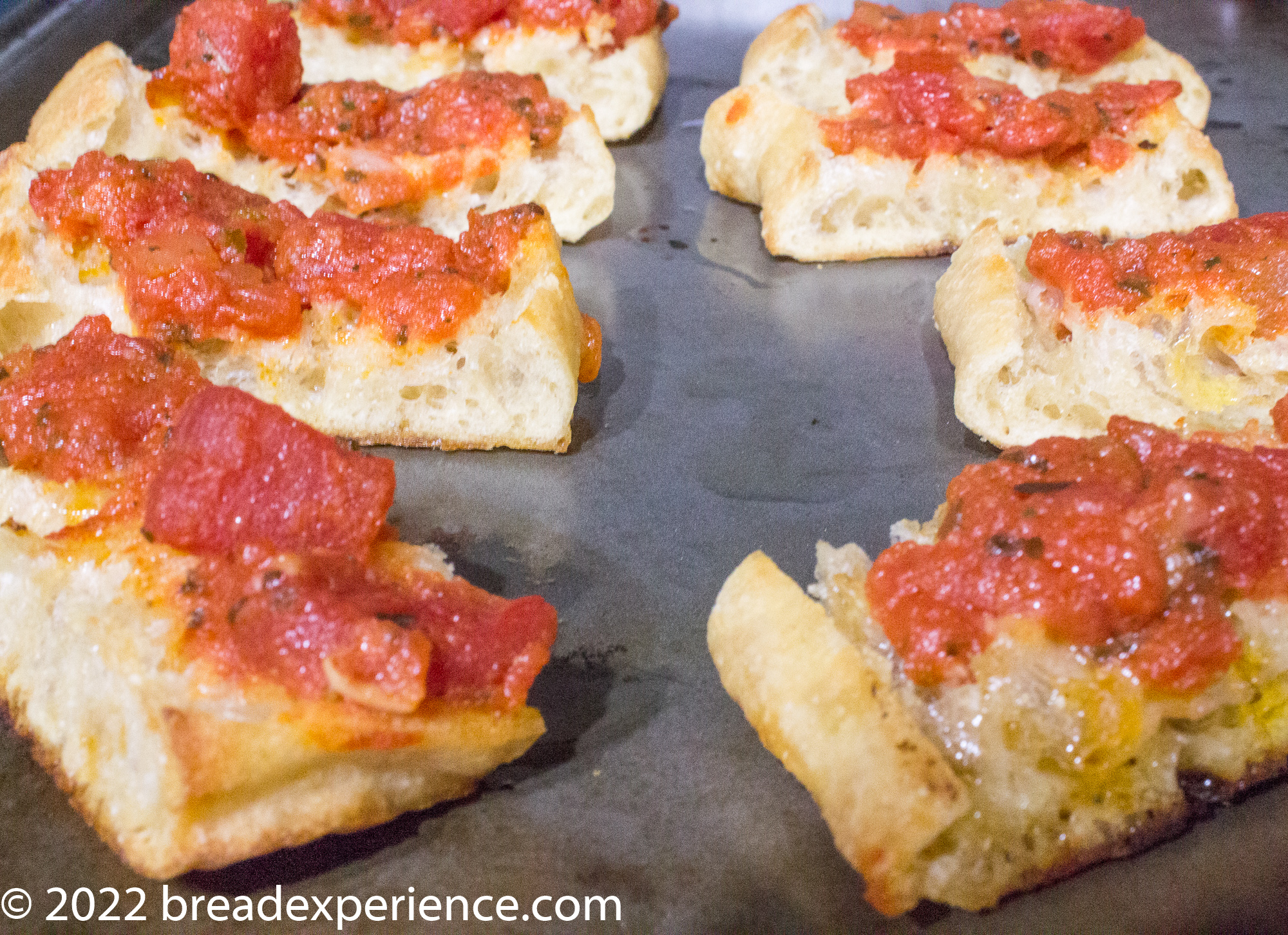 Glass Bread toasted and spread with tomato topping