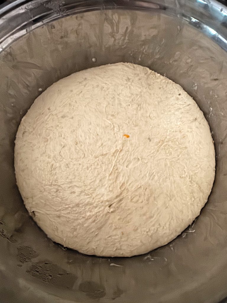 Pompe à l’huile dough doubled in a glass bowl after the bulk ferment.