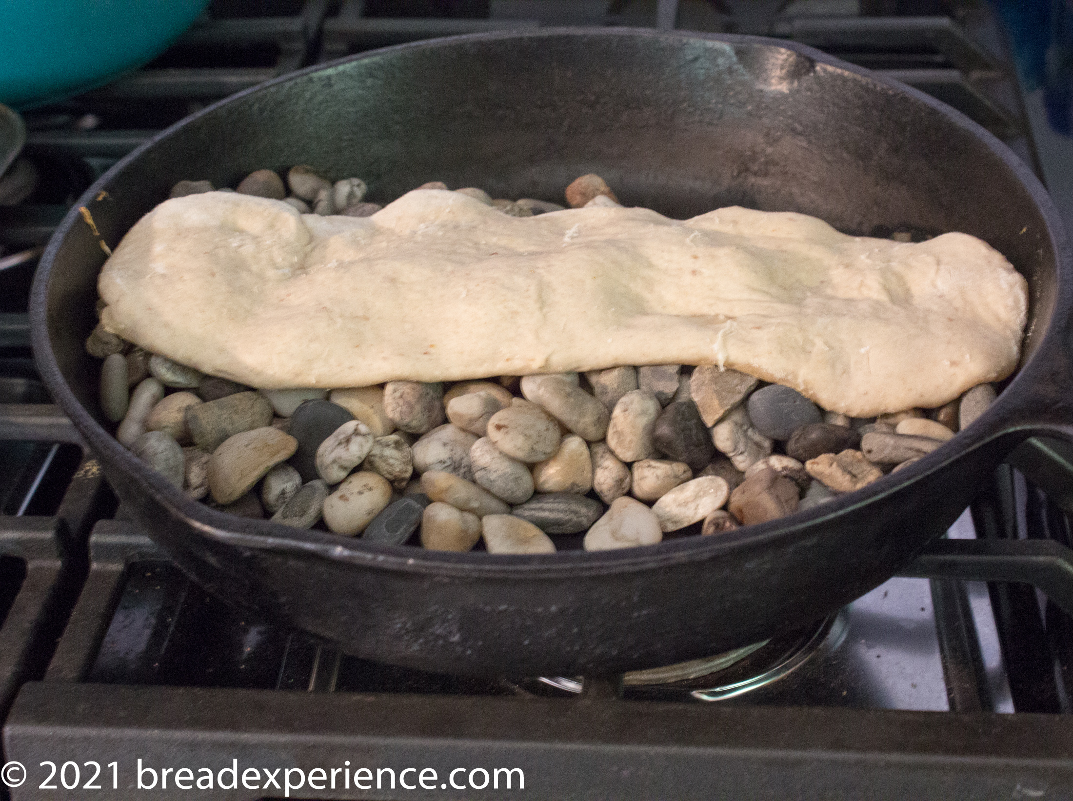 Baking Sangak on hot river rocks