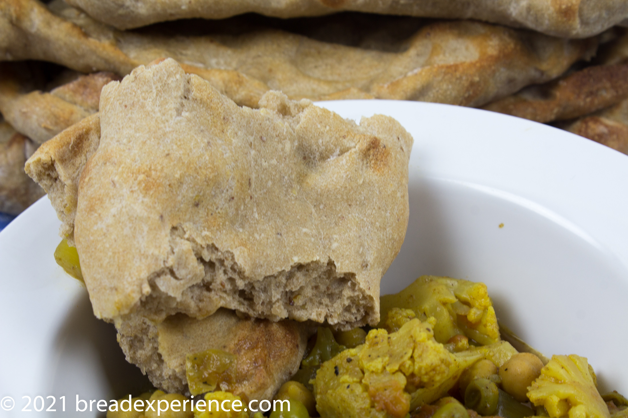 Close up shot of Sangak with Cauliflower and Chickpea Masala