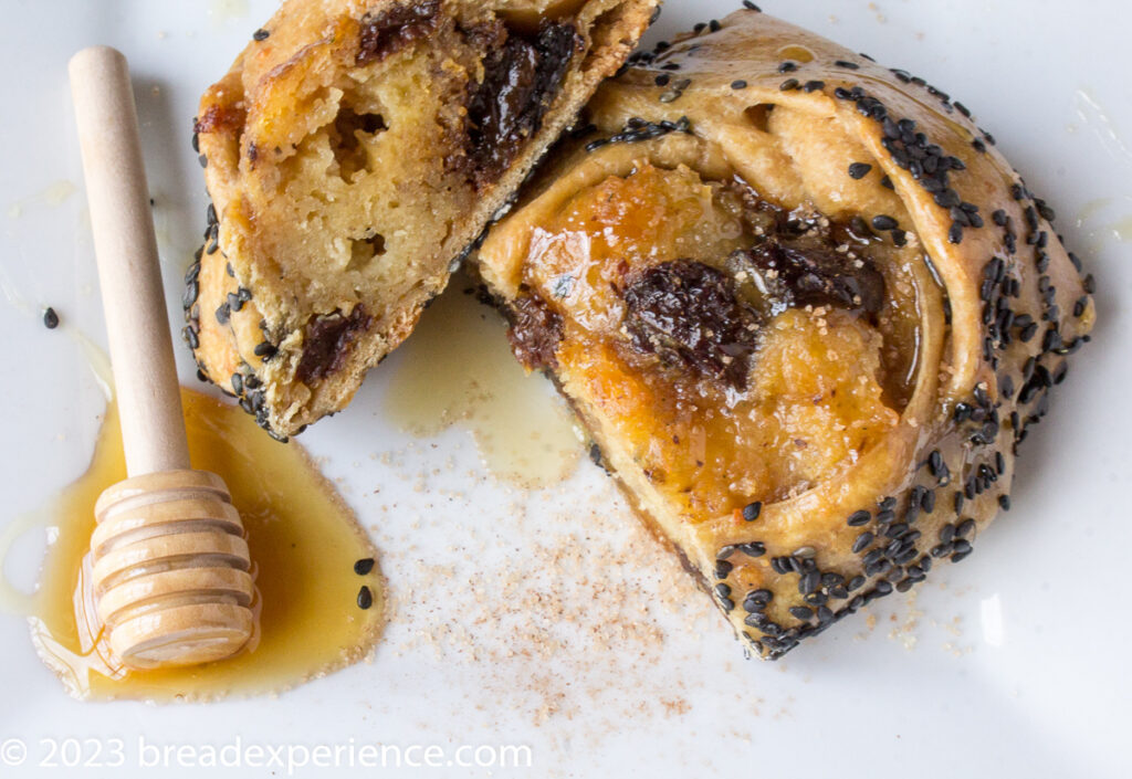 Sourdough Einkorn Cypriot Flaounes sliced and served with honey and cinnamon