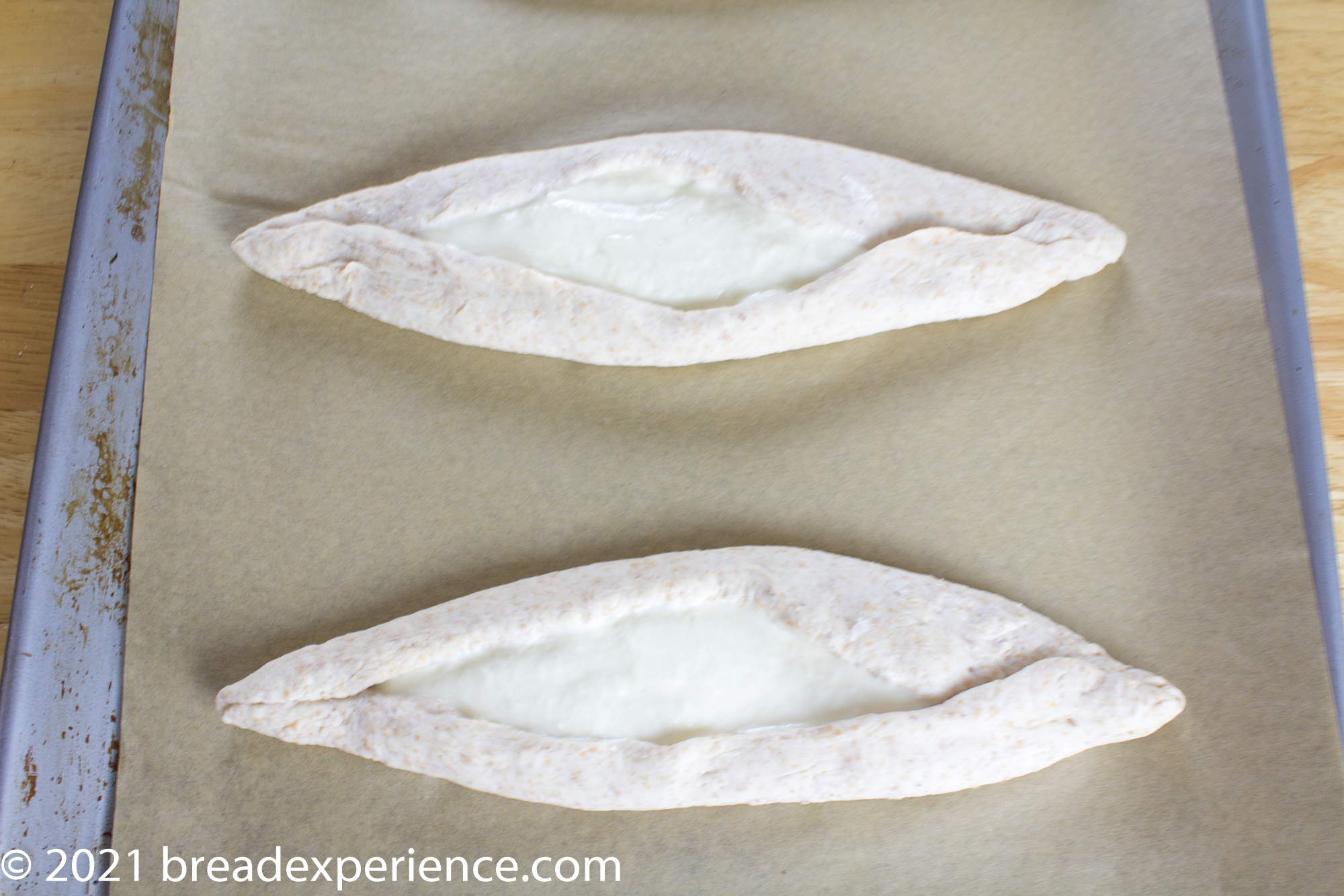 shaped and filled Ekmak bread boats