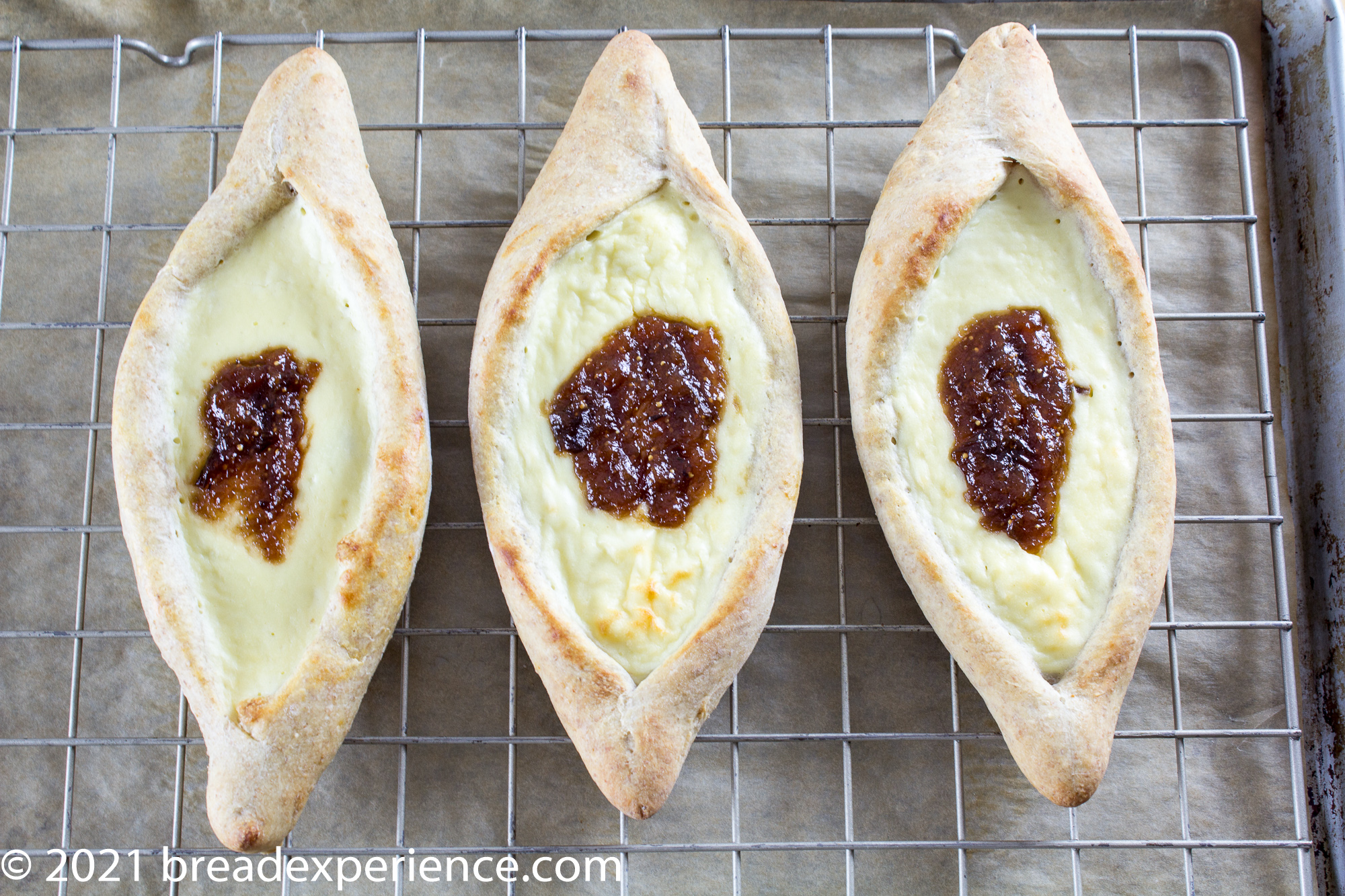 Ekmak with cheese filling and topped with fig jam