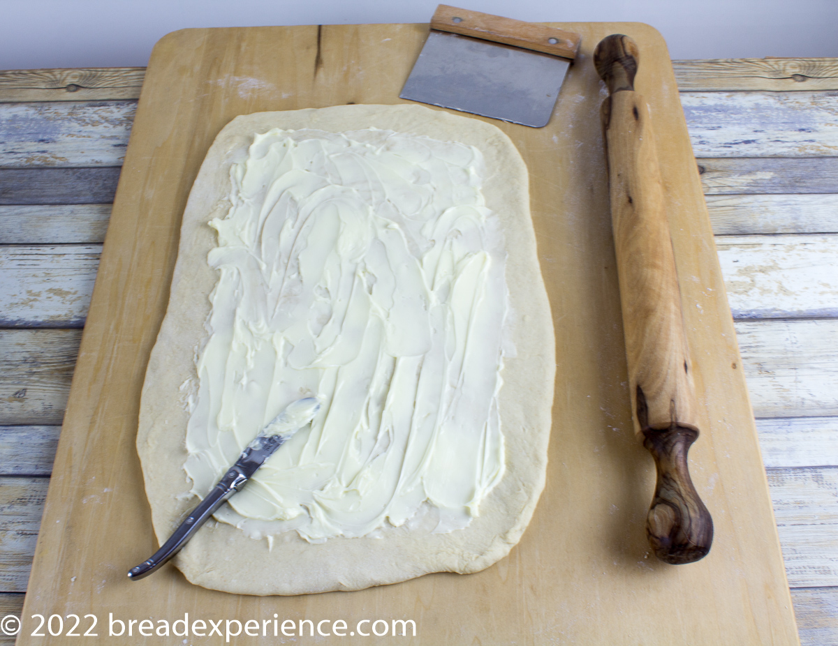 crescent dough rolled out and brushed with butter