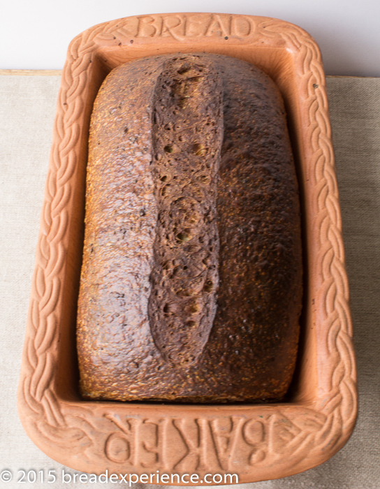 Sourdough Green Pea and Match Bread baked in stoneware baker